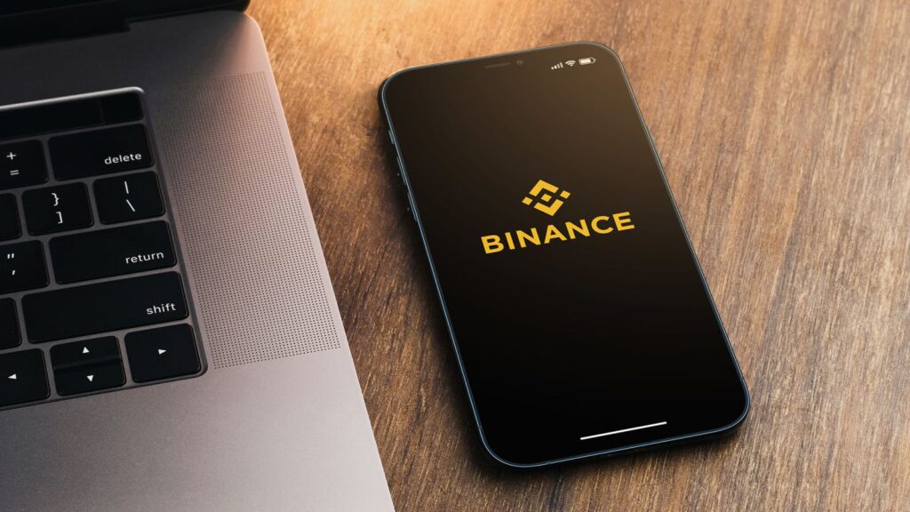 Binance, criptomoedas, compliance, regulação, contratação, mercado financeiro, Departamento de Justiça, SEC, multas, expansão empresarial